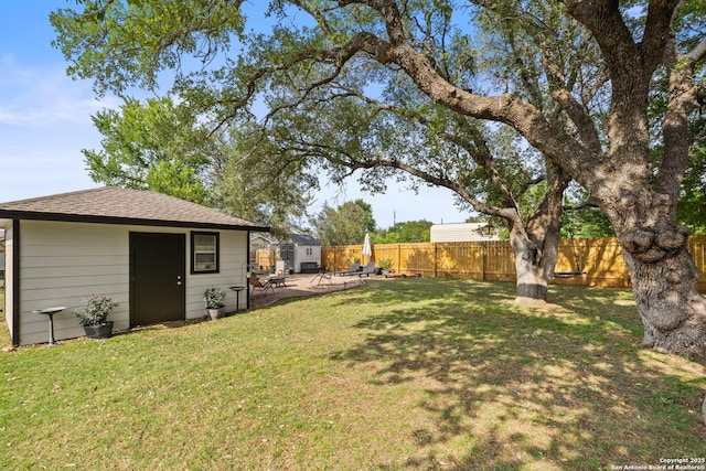 113 E Dawn Dr, Johnson City, TX 78636 - view of yard featuring an outdoor structure and a fenced backyard