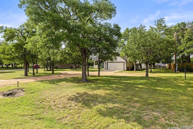 113 E Dawn Dr, Johnson City, TX 78636 - view of yard with a detached garage