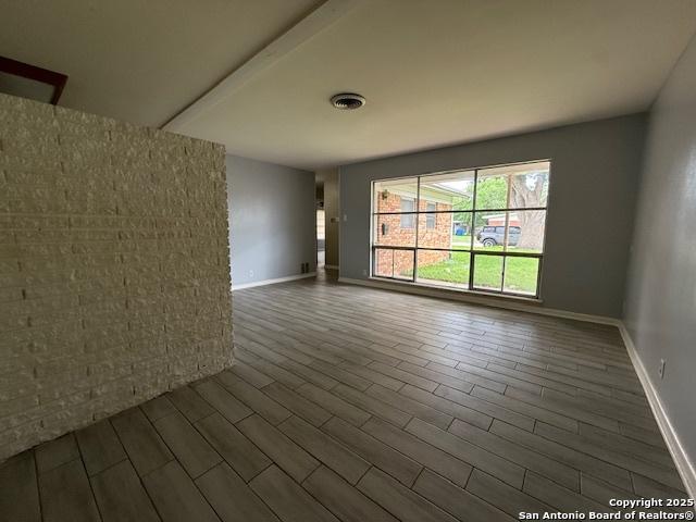 4519 Creekmoor, San Antonio, TX 78220 - spare room with wood finished floors and baseboards