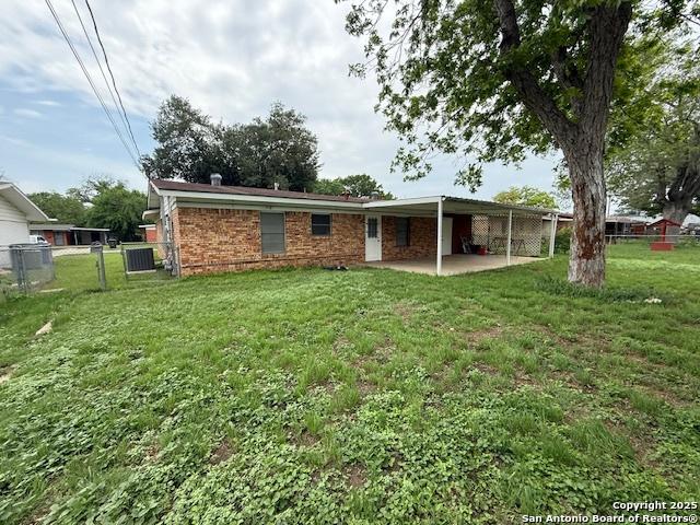 4519 Creekmoor, San Antonio, TX 78220 - back of property with a patio area, brick siding, and central AC unit