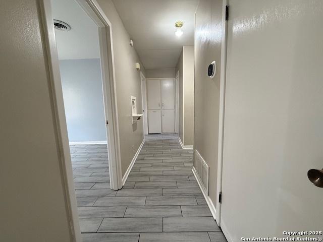 4519 Creekmoor, San Antonio, TX 78220 - hall featuring wood tiled floors and baseboards