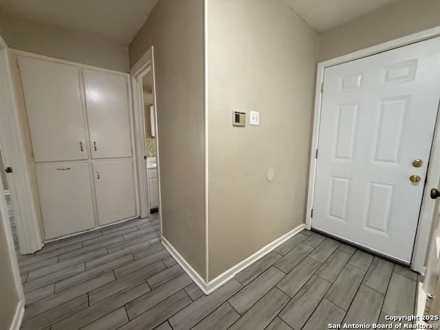 4519 Creekmoor, San Antonio, TX 78220 - corridor with wood finish floors and baseboards