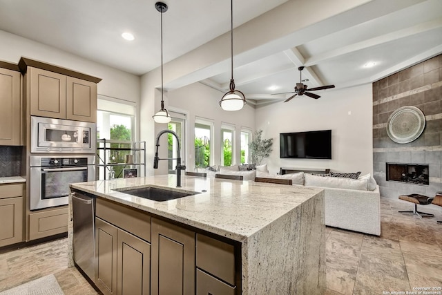 7211 Cresta Bulivar, San Antonio, TX 78256 - kitchen featuring a sink, appliances with stainless steel finishes, a wealth of natural light, and beamed ceiling