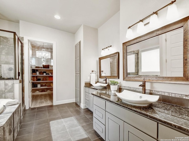 7211 Cresta Bulivar, San Antonio, TX 78256 - full bath featuring tile patterned flooring, a sink, double vanity, and a shower stall