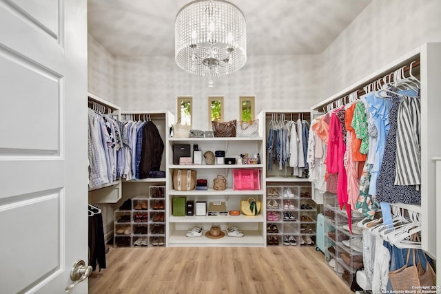 7211 Cresta Bulivar, San Antonio, TX 78256 - spacious closet with a notable chandelier and wood finished floors
