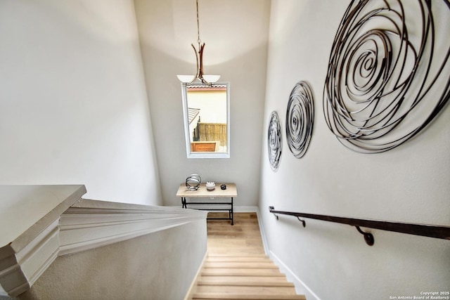 7211 Cresta Bulivar, San Antonio, TX 78256 - stairs with baseboards and wood finished floors