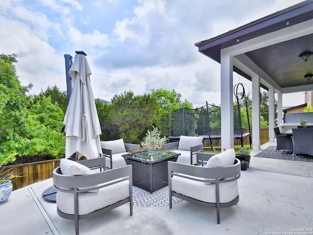 7211 Cresta Bulivar, San Antonio, TX 78256 - view of patio / terrace featuring an outdoor hangout area, fence, and a trampoline