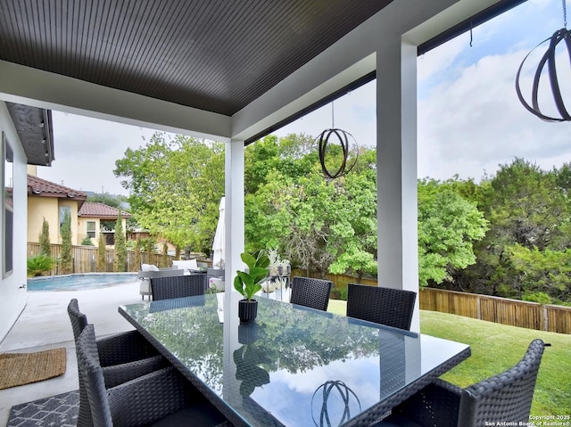7211 Cresta Bulivar, San Antonio, TX 78256 - view of patio / terrace with outdoor dining area, a fenced backyard, and a fenced in pool