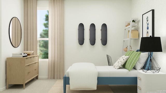 carpeted bedroom featuring baseboards