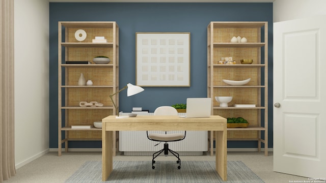 carpeted office featuring baseboards and built in features