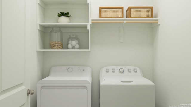 clothes washing area featuring laundry area and washing machine and dryer