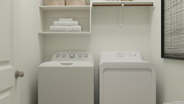 washroom featuring separate washer and dryer and laundry area