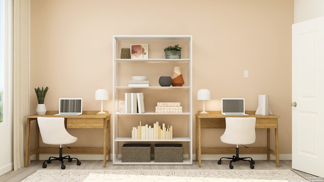 office area with baseboards and wood finished floors