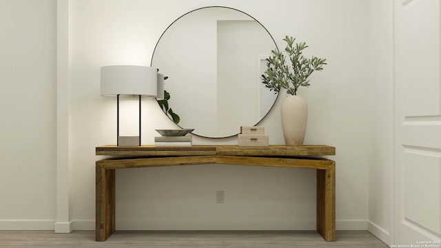 room details featuring baseboards and wood finished floors