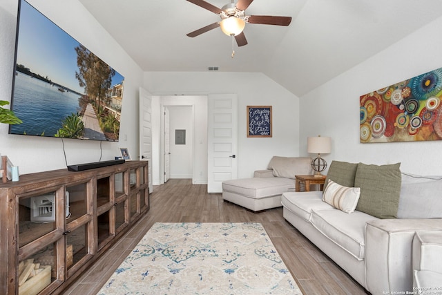 140 Cordova, Boerne, TX 78006 - living area with ceiling fan, wood finished floors, lofted ceiling, baseboards, and electric panel