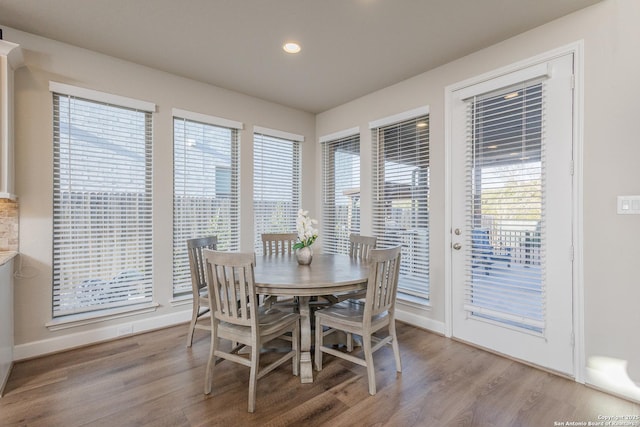 dining space with baseboards, recessed lighting, and light wood-style flooring
