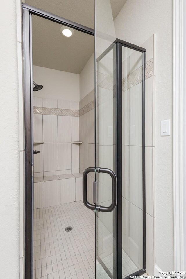 bathroom featuring a shower stall and recessed lighting