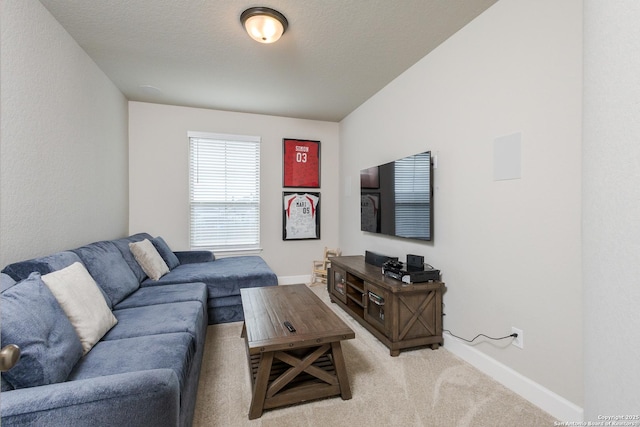living room with baseboards and light carpet