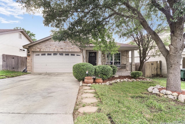 view of front of house featuring concrete driveway, brick siding, an attached garage, and fence