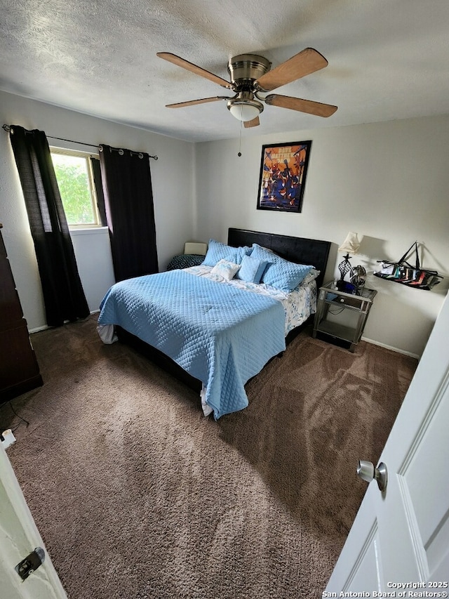 4802 Castle Brg, San Antonio, TX 78218 - bedroom featuring carpet, a ceiling fan, and a textured ceiling