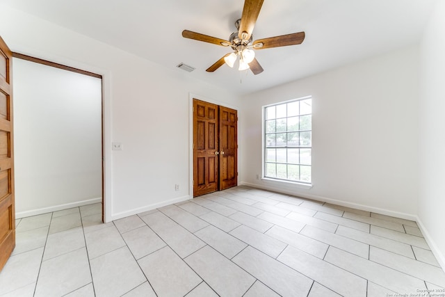 10526 Tioga, San Antonio, TX 78230 - unfurnished bedroom featuring baseboards, a ceiling fan, a closet, and visible vents