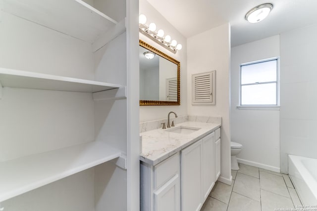 10526 Tioga, San Antonio, TX 78230 - bathroom featuring baseboards, vanity, tile patterned floors, a bathing tub, and toilet