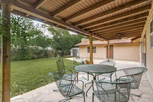 10526 Tioga, San Antonio, TX 78230 - view of patio featuring a storage unit, ceiling fan, an outbuilding, and outdoor dining space