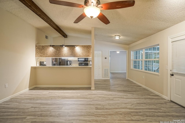 kitchen featuring visible vents, wood finished floors, ceiling fan, a textured ceiling, and black appliances