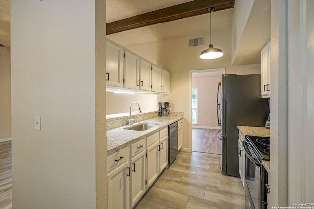 kitchen featuring a sink, black appliances, white cabinetry, and visible vents