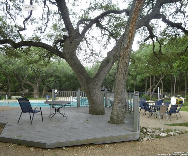 13110 Vista Del Mundo, San Antonio, TX 78216 - deck featuring a community pool and fence