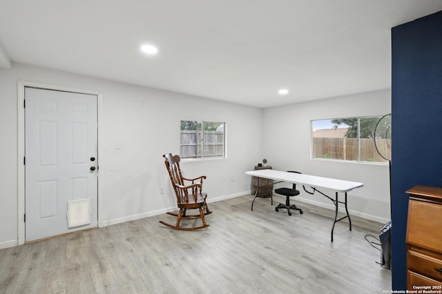 office space featuring recessed lighting, baseboards, plenty of natural light, and wood finished floors