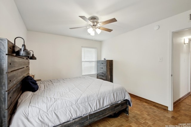 bedroom featuring baseboards, visible vents, and ceiling fan
