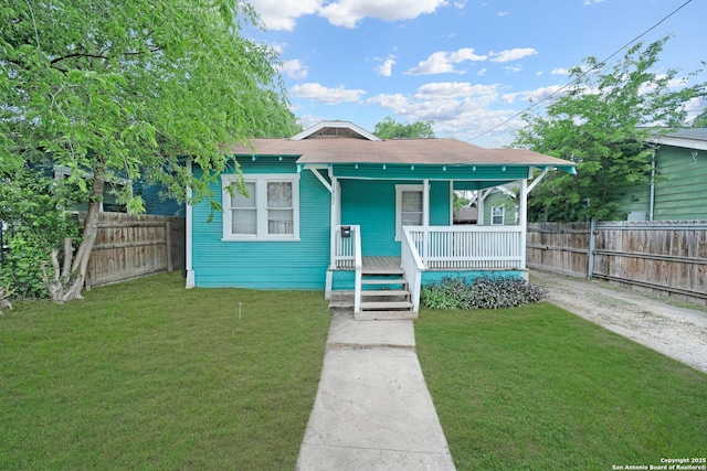 1607 Hays, San Antonio, TX 78202 - bungalow-style house with covered porch, fence, and a front lawn