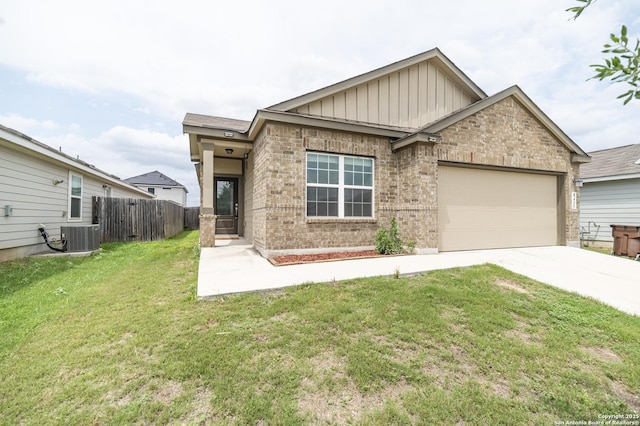craftsman inspired home with fence, a garage, board and batten siding, a front yard, and concrete driveway
