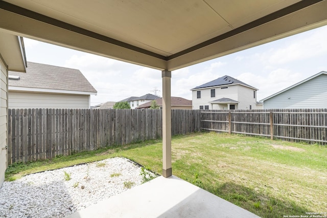 view of yard with a fenced backyard and a patio area