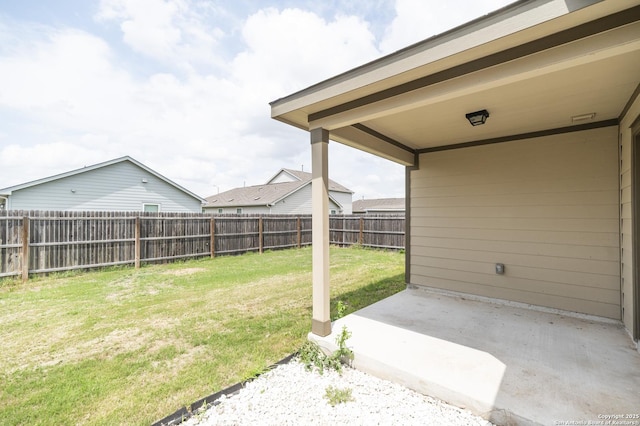 view of yard with a fenced backyard and a patio