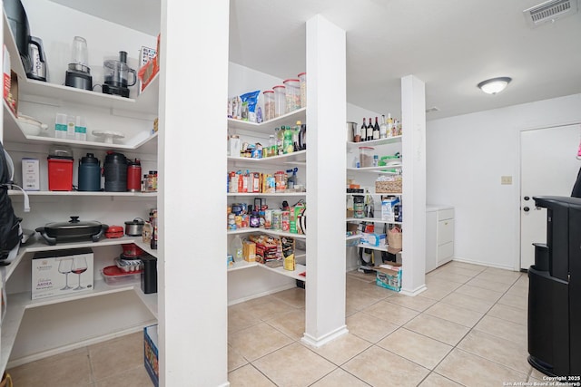 pantry with visible vents and washer / dryer