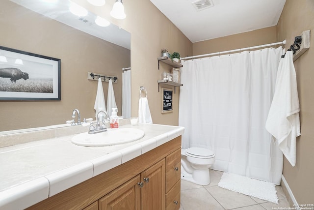 bathroom with toilet, tile patterned floors, visible vents, and vanity