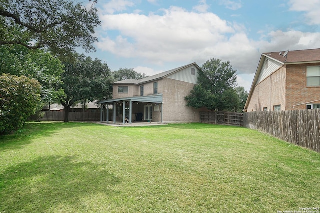 view of yard featuring a patio and a fenced backyard