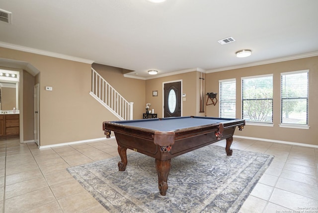 playroom featuring light tile patterned floors, baseboards, and ornamental molding