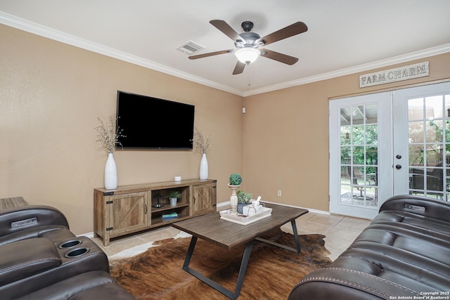 living area featuring ceiling fan, french doors, visible vents, light tile patterned floors, and ornamental molding