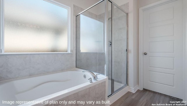 21031 Millstream Bnd, San Antonio, TX 78266 - bathroom with a garden tub, a stall shower, and wood finished floors