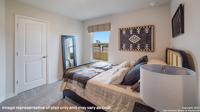bedroom featuring baseboards and carpet