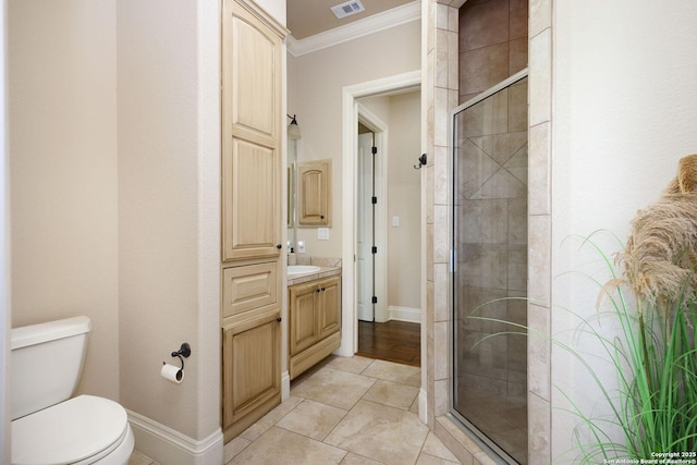 bathroom with vanity, baseboards, ornamental molding, and a shower stall