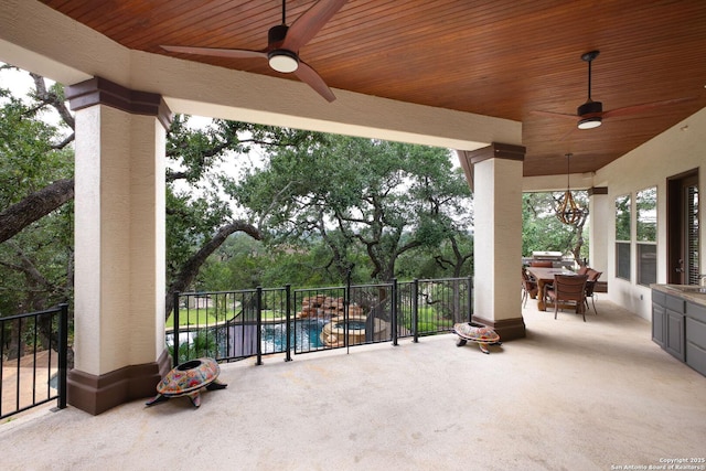 view of patio / terrace with outdoor dining area, a ceiling fan, and a fenced in pool