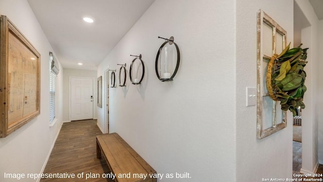 hallway featuring baseboards, recessed lighting, and wood finished floors