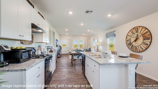 kitchen featuring visible vents, open floor plan, under cabinet range hood, a sink, and black appliances