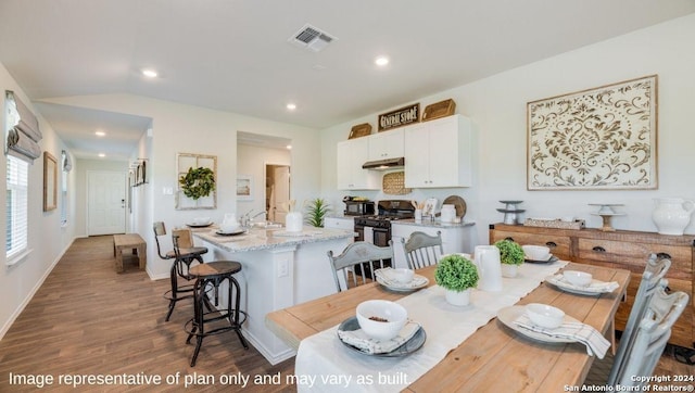 dining space with visible vents, recessed lighting, dark wood finished floors, and baseboards