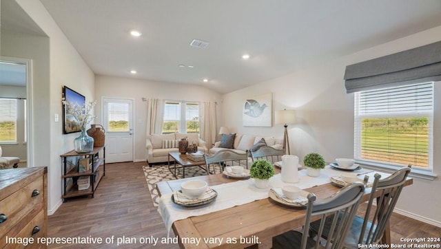 dining area featuring visible vents, lofted ceiling, baseboards, recessed lighting, and dark wood finished floors