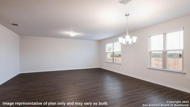 14610 Clay Ridge Run, San Antonio, TX 78253 - spare room with baseboards, a notable chandelier, dark wood-style floors, and visible vents